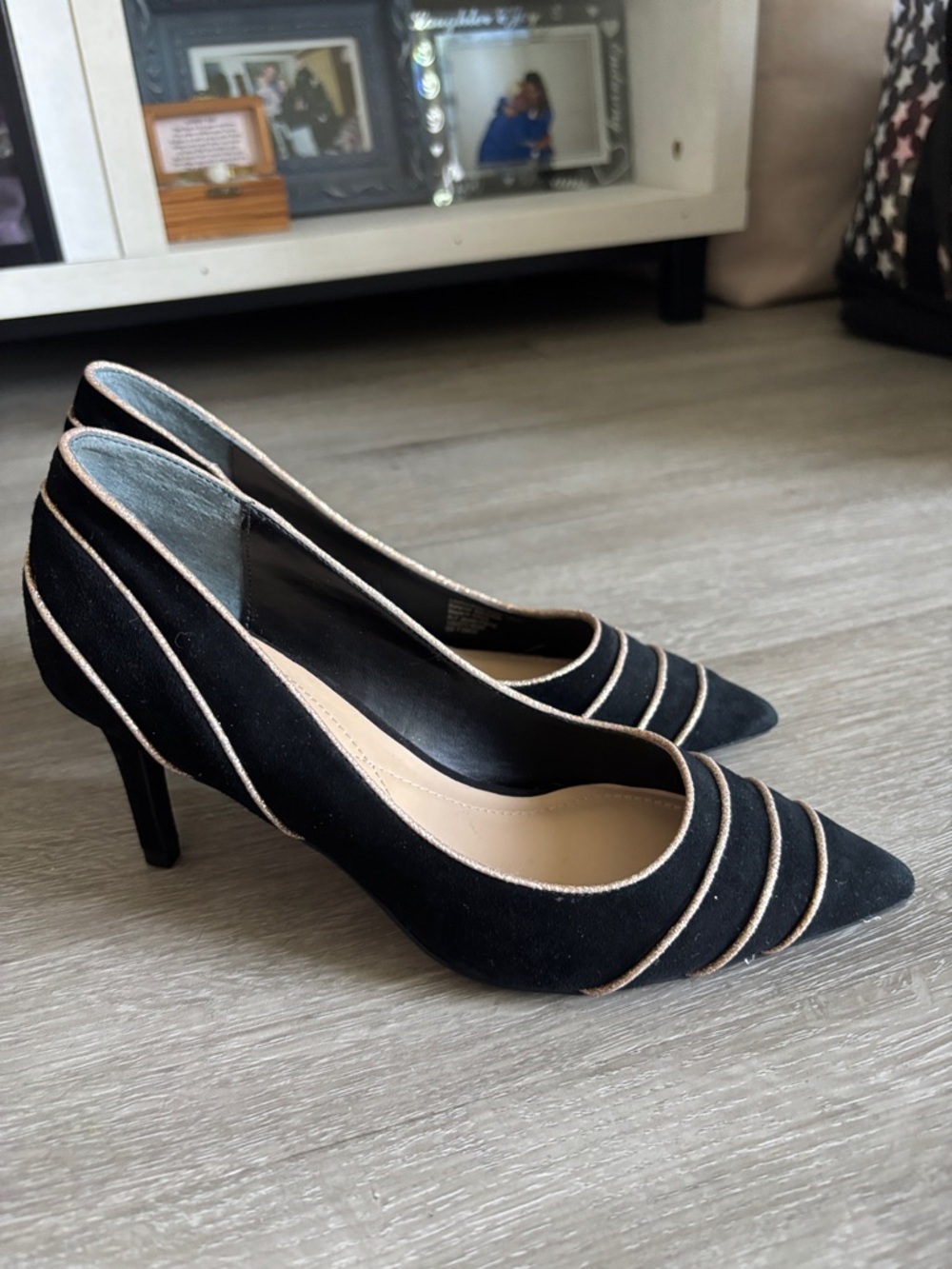 Black heels with gold accents